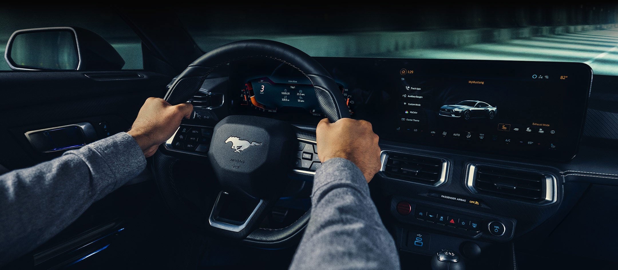 A 2024 Ford Mustang® model interior with a person driving | Donley Ford of Galion, Inc. in Galion OH